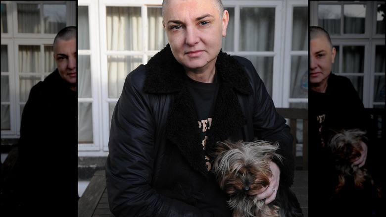 Sinead O'Connor posing with her dog