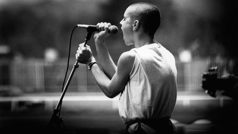 Sinead O'Connor from behind singing on stage