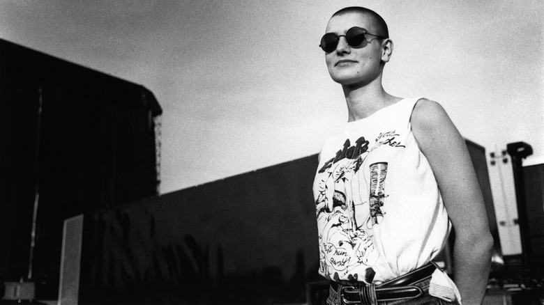 Sinead O'Connor black and white sunglasses and a t-shirt