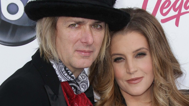 Michael Lockwood and Lisa Marie Presley event pose to camera