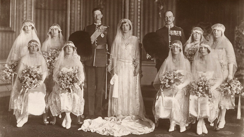 Beagles' postcard of Princess Mary (bride center) and Viscount Lascelles (groom centre left) with their bestman and their bridesmaids.