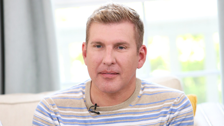 Todd Chrisley in striped shirt