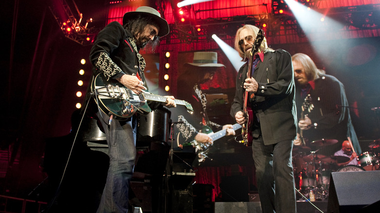 Mike Campbell and Tom Petty of Tom Petty and the Heartbreakers perform on stage with the band