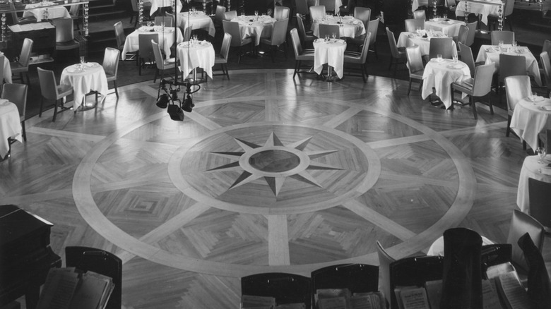 The Rainbow Room dance floor white table cloth tables