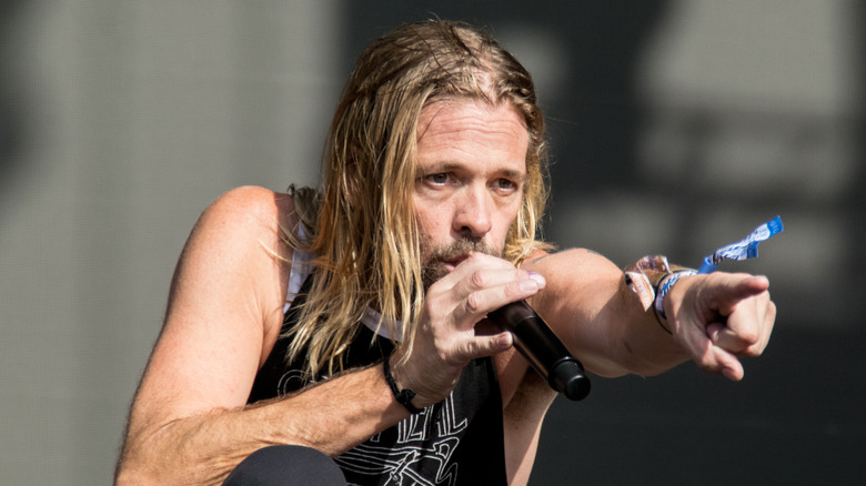 Taylor Hawkins with a microphone