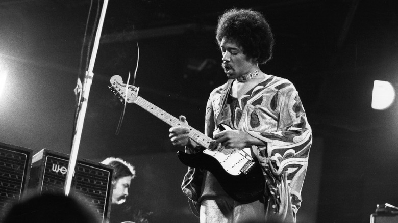 Black and grey image of Jimi Hendrix performing