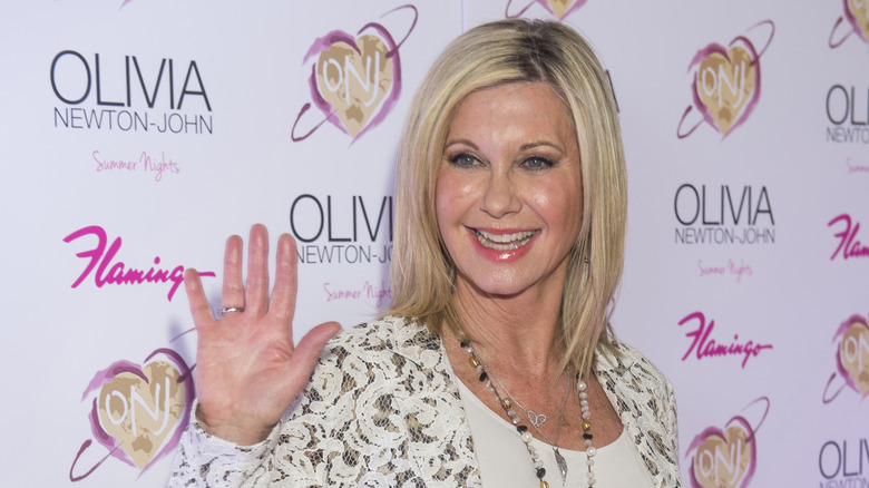 Olivia Newton-John waving