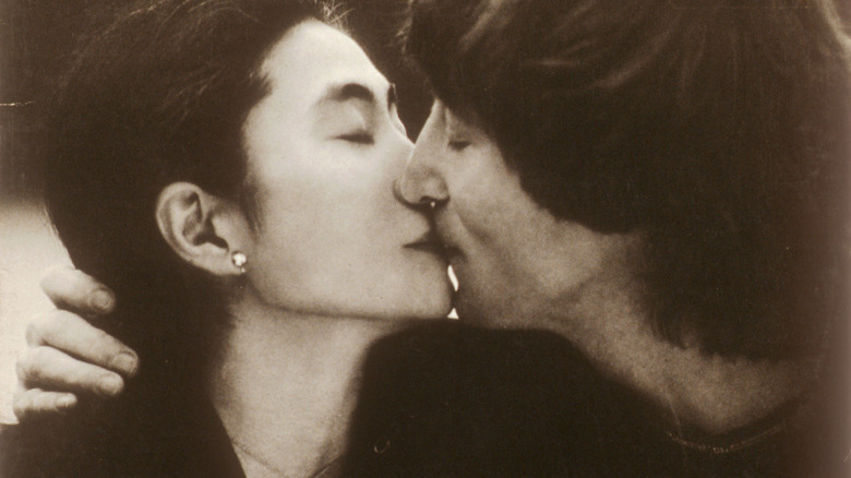 John Lennon and Yoko Ono kissing