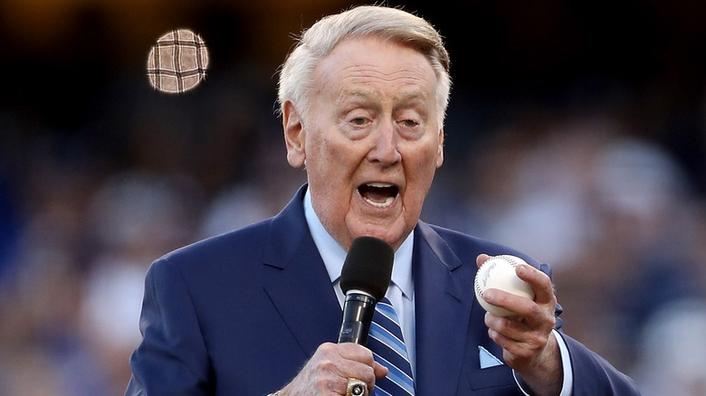 Vin Scully holding baseball