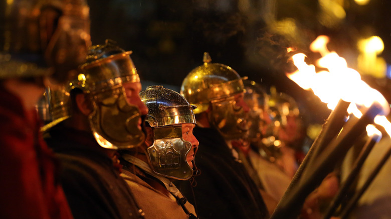 roman helmets reenactors fire 