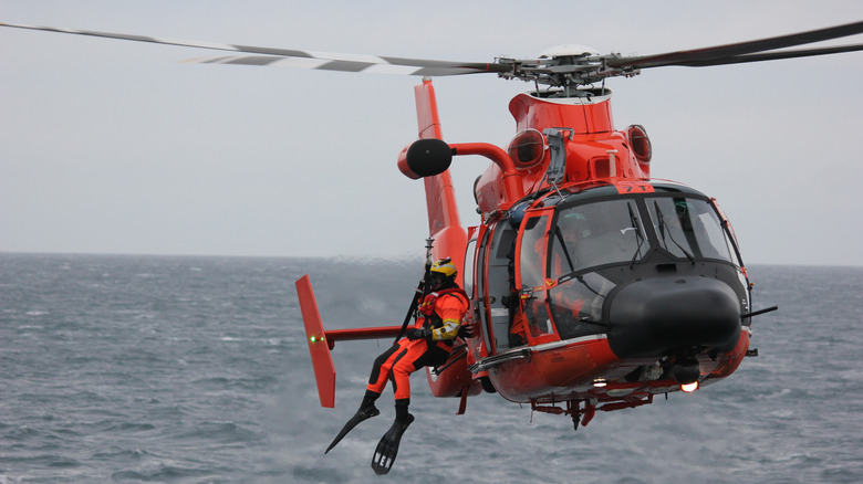 Rescue helicopter over ocean