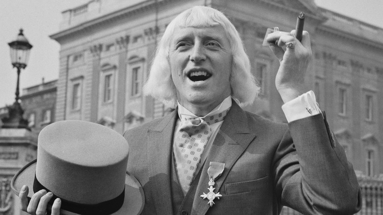 Jimmy Savile with a cigar