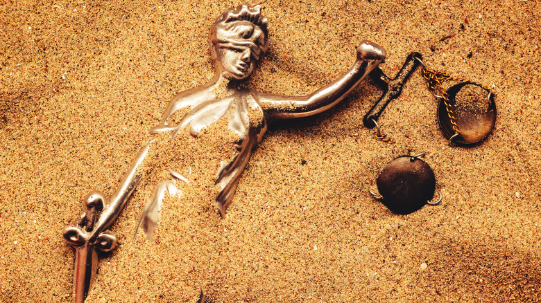 Justice buried in sand