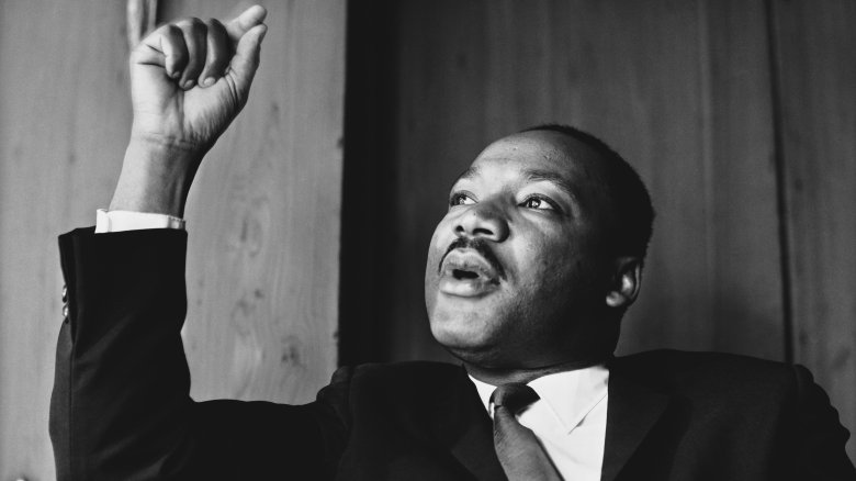 Martin Luther King Jr. speaking pointing up