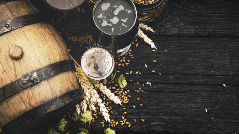 overhead view of beer in glass with wood cask