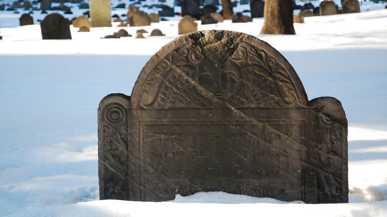 colonial headstone in snow