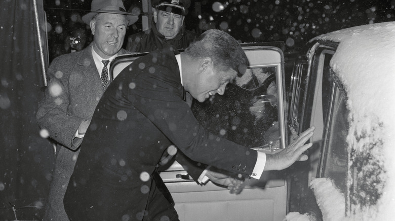 JFK getting into a car in the snow