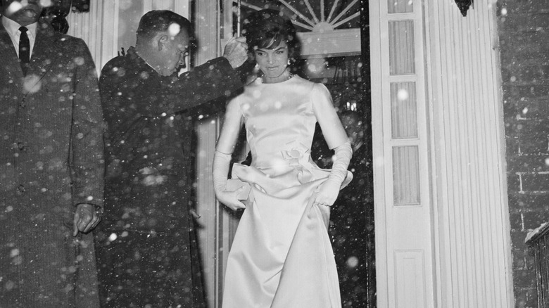 Jackie Kennedy leaving on a snowy night for party