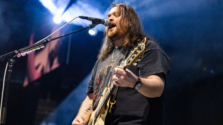 Wolfgang Van Halen singing and playing guitar at the Little Caesars Arena