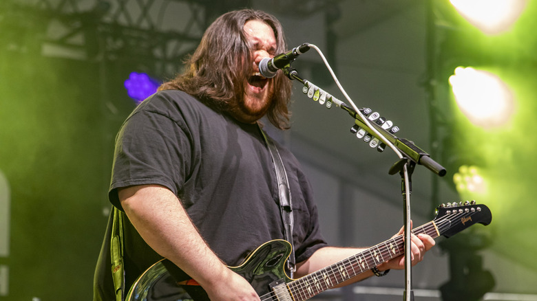 Wolfgang Van Halen singing and playing guitar on stage at the 2021 Shaky Knees Festival