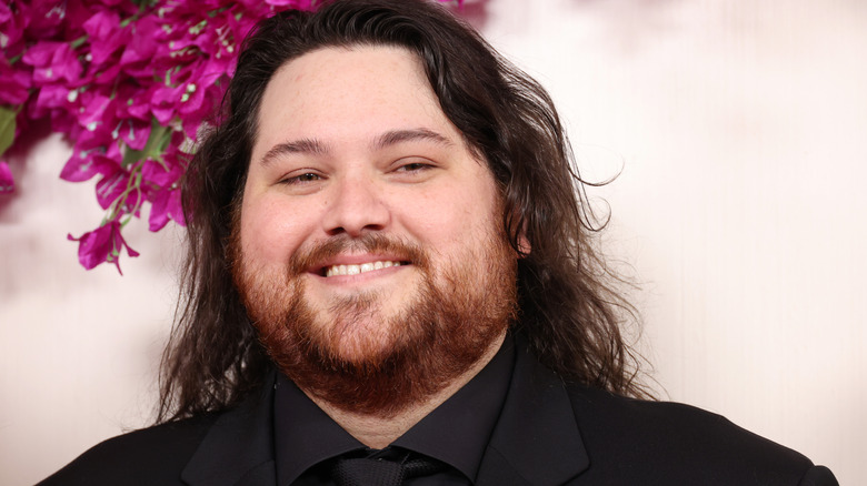 Wolfgang Van Halen smiling at the 2024 Academy Awards