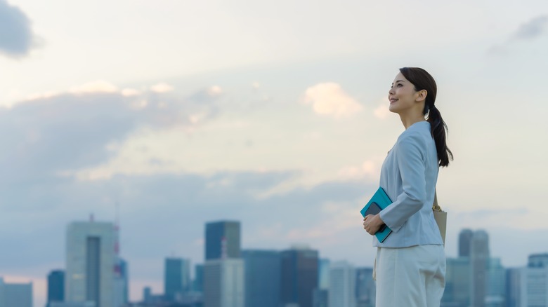 woman looking sky city