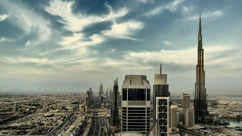 Burj Khalifa towering over other buildings in Dubai