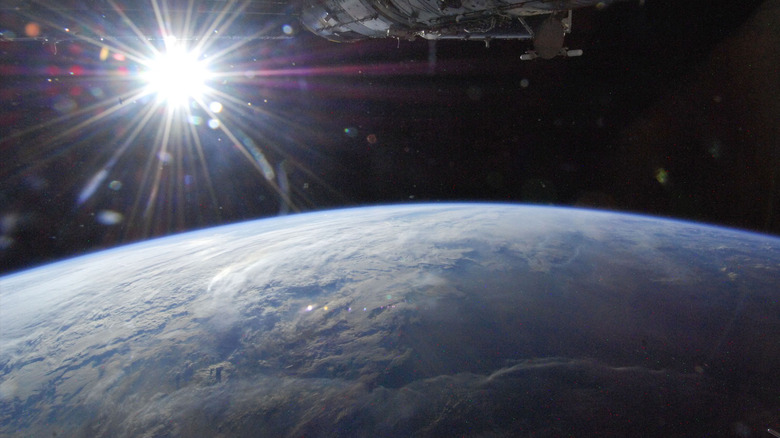 Earth and the Sun, from orbit.