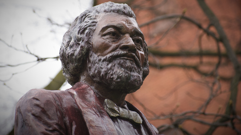 Statue of Fredrick Douglass under tree