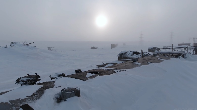 Desolate winter scene of an abandoned factory frozen over