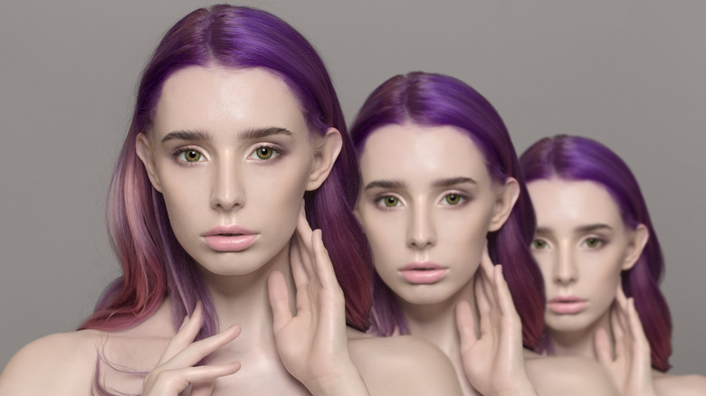 three women clones with purple hair