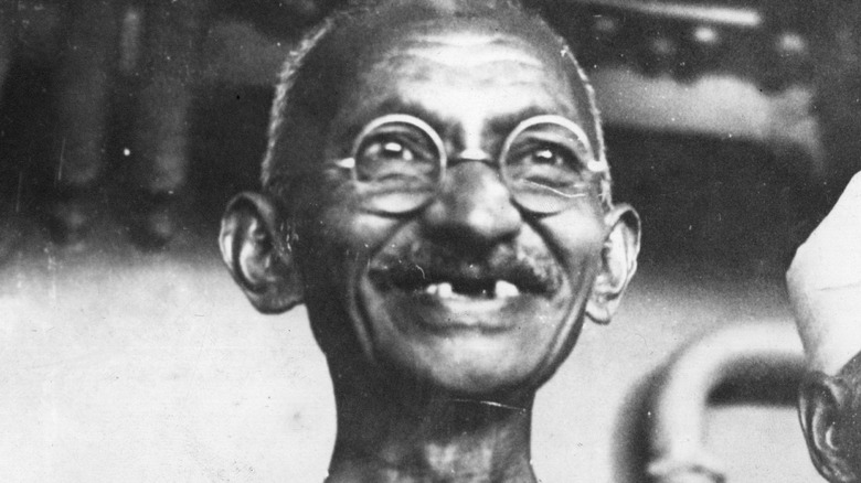 Mahatma Gandhi smiling looking up