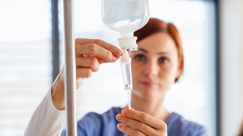 Nurse with IV drip bag