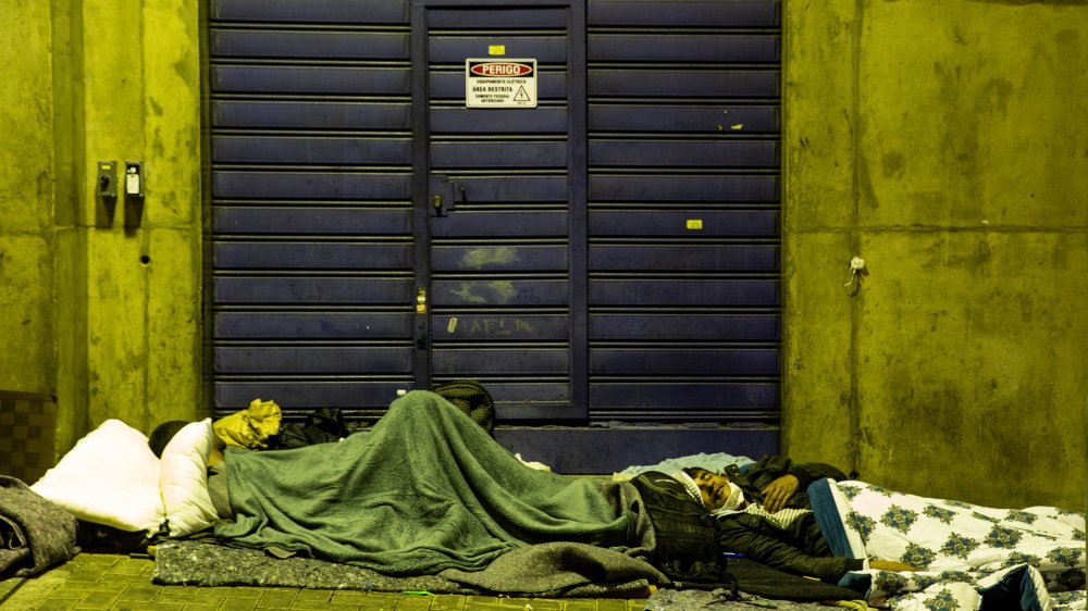 A couple of homeless people sleeping in Sao Paulo, Brazil 