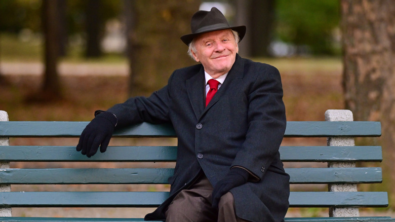 Anthony Hopkins sitting on bench