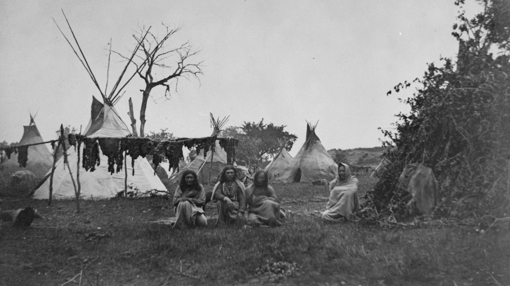 Arapaho camp with buffalo meat drying near Fort Dodge, Kansas, 1870