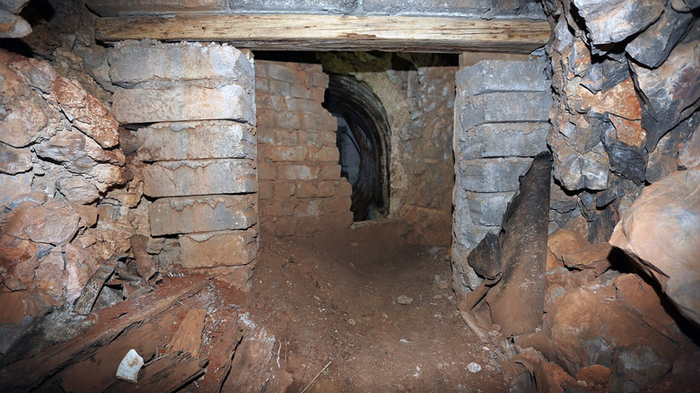 partially bricked-up entrance to Operation Tracer cave on Gibraltar