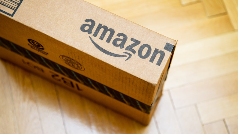 A cardboard box with Amazon branding