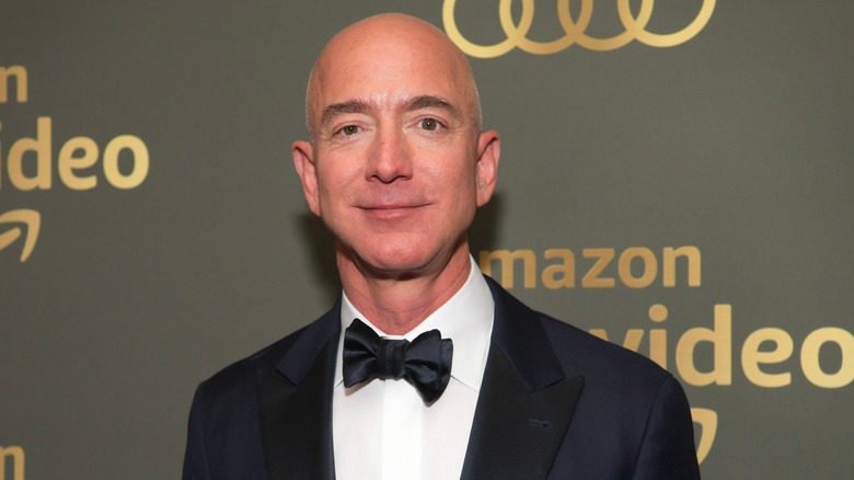 Jeff Bezos smiling and wearing a tuxedo