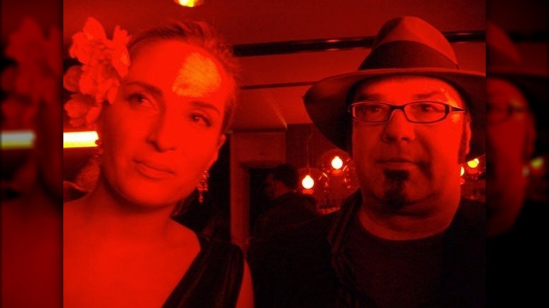 Sarah Scott and Jonathan Kochmer glasses fedora red lit