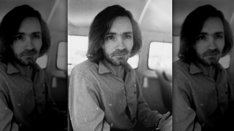 Charles Manson handcuffed in a van