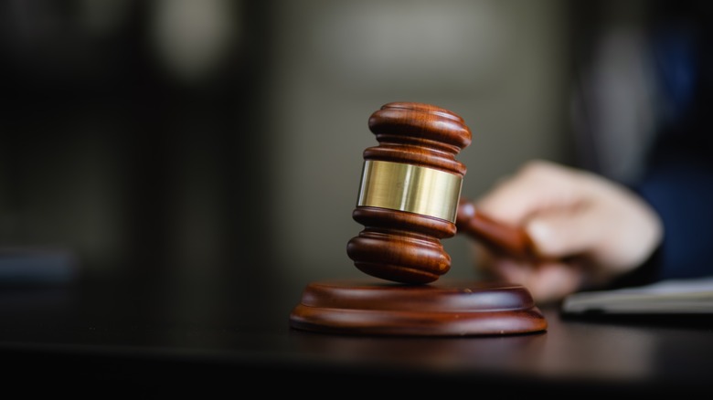 Judge's gavel on wooden table