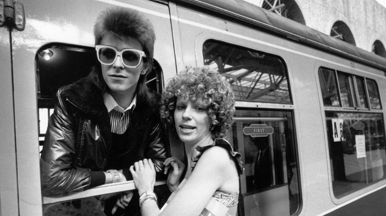 David Bowie and wife Angie at train station