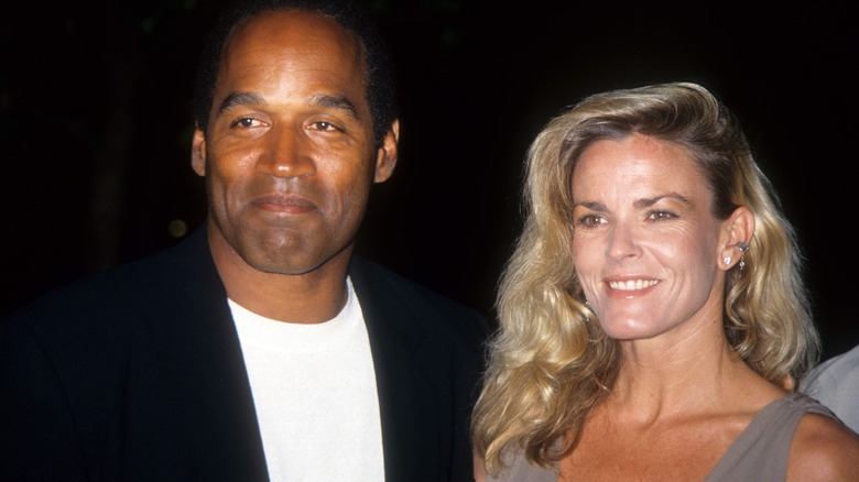 OJ Simpson and Nicole Brown Simpson smiling for photo