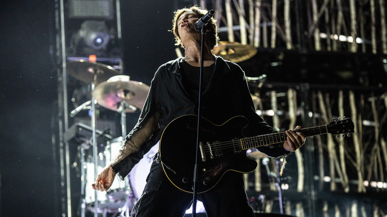 Stephen Jenkins singing and playing guitar