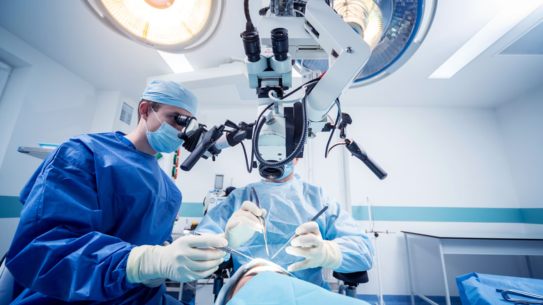 surgeons working on a brain