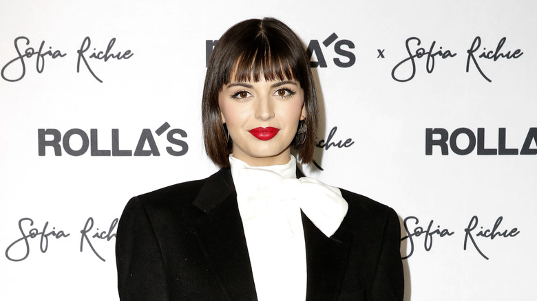 Rebecca black red lipstick suit