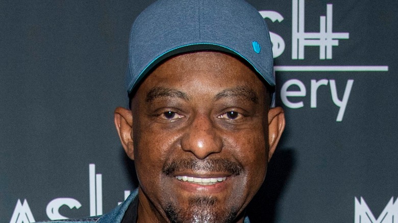 David Joyner wearing a cap and smiling