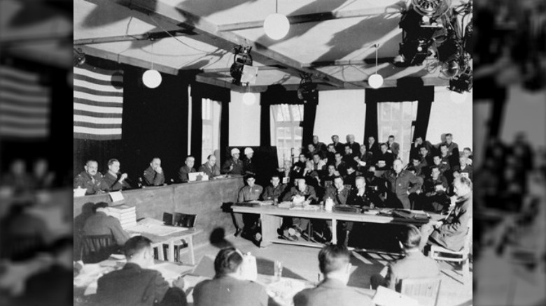 men giving testimony during dachau trials