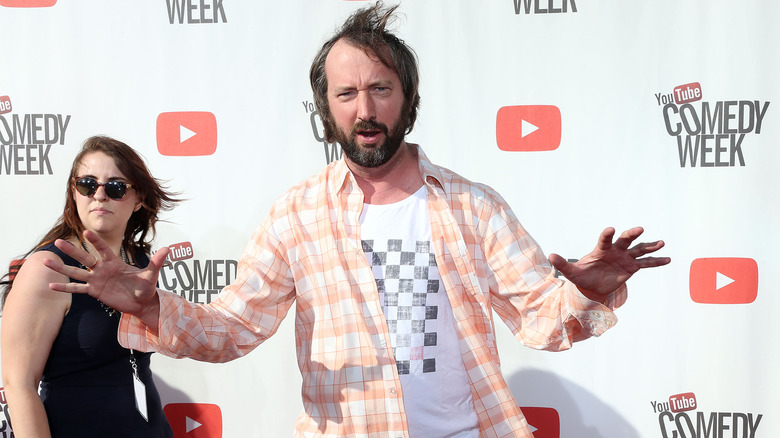 Tom Green holding up hands